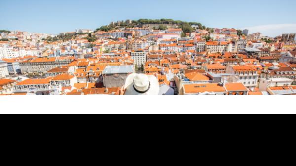 Young woman tourist enjoying beautiful cityscape top view on the old town during the sunny day in Lisbon city, Portugal credit: istock
one time use for Traveller only
