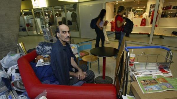 Merhan Karimi Nasseri sits among his belo<em></em>ngings at Terminal 1 of Roissy Charles De Gaulle Airport, Paris.